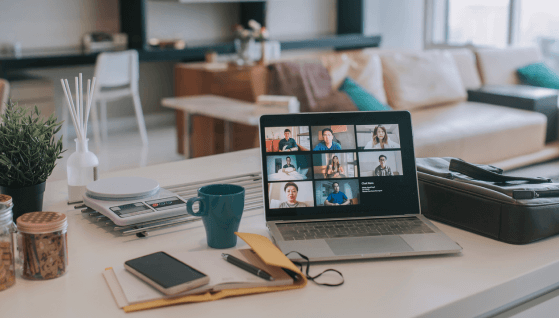 Laptop with screen video conference on kitchen counter